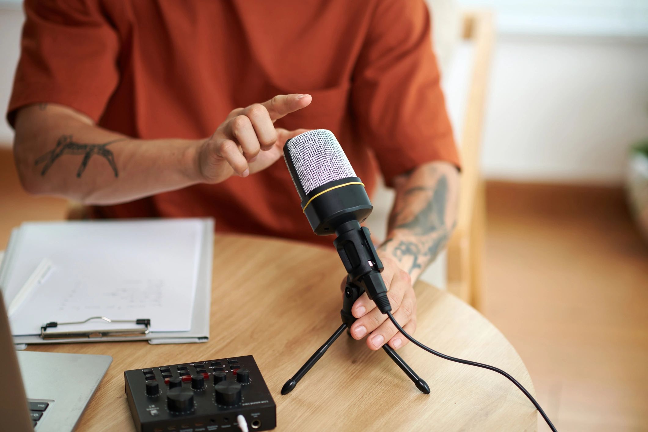 Podcaster checking a microphone