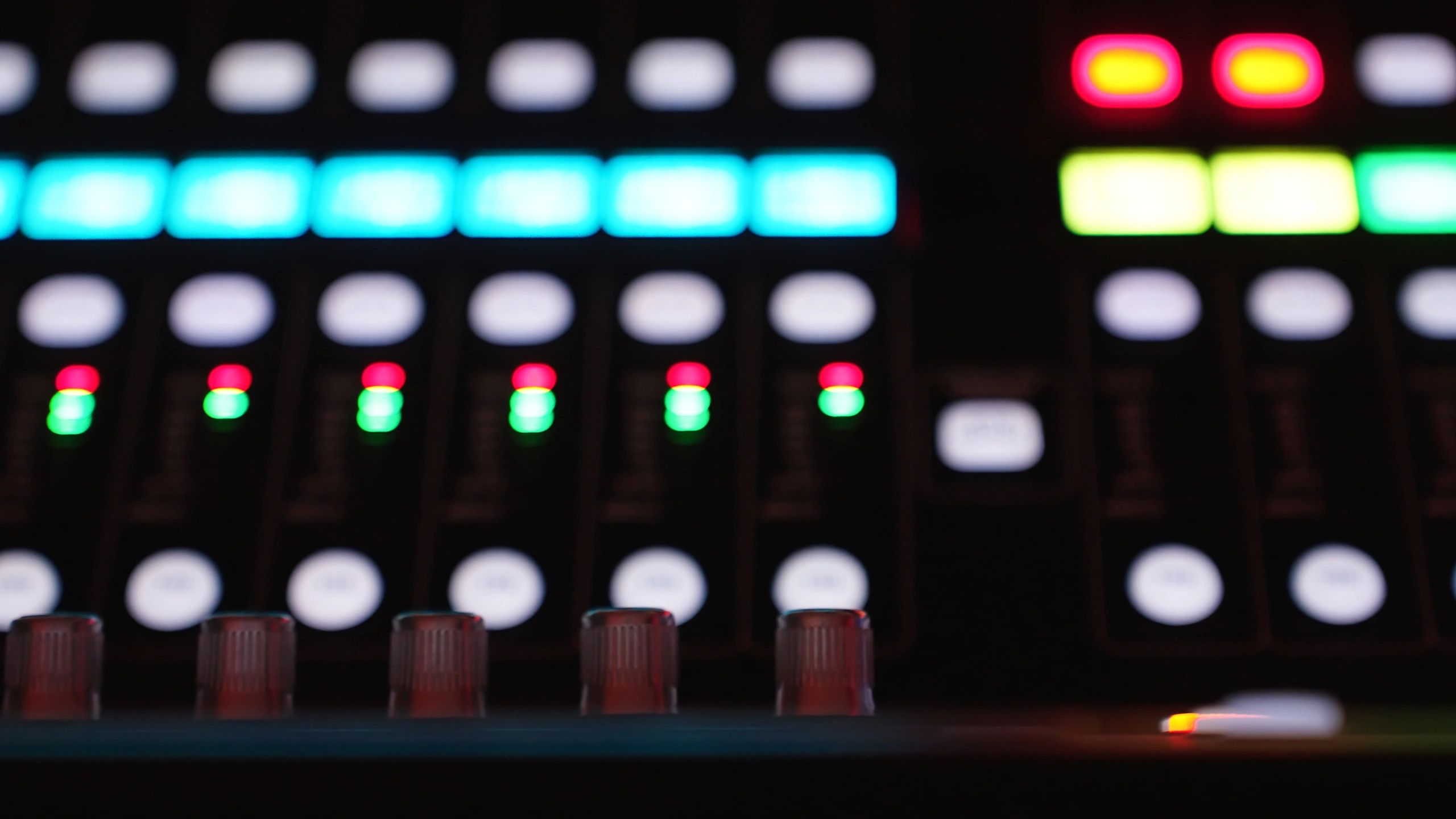 Closeup of faders on a mixing console with copy space